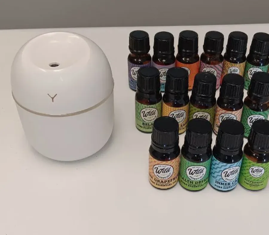 Wild Essentials pure essential oils with a white diffuser, chosen at the start of each session