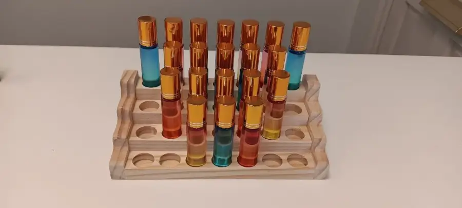 A wooden rack of CBD roll-ons that CBD clients take home after every session
